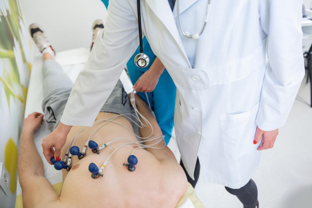 Clinician placing ECG electrodes on a patient's chest