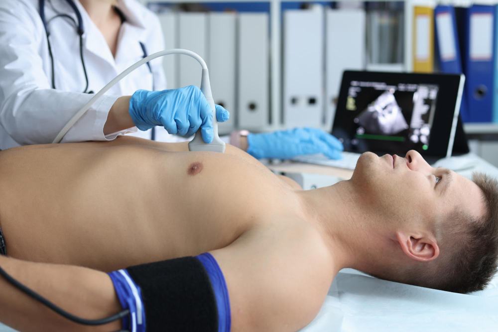 Sonographer performing an echocardiogram on a patient's chest